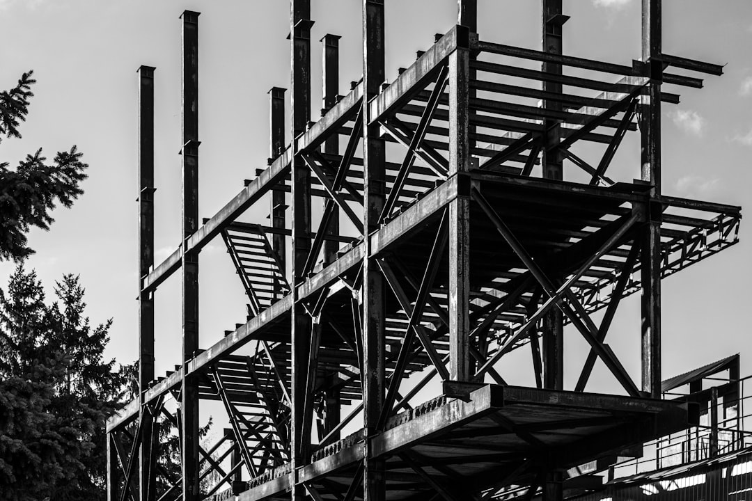 gallery-5 a-black-and-white-photo-of-a-building-under-construction-toqe8dohnmq