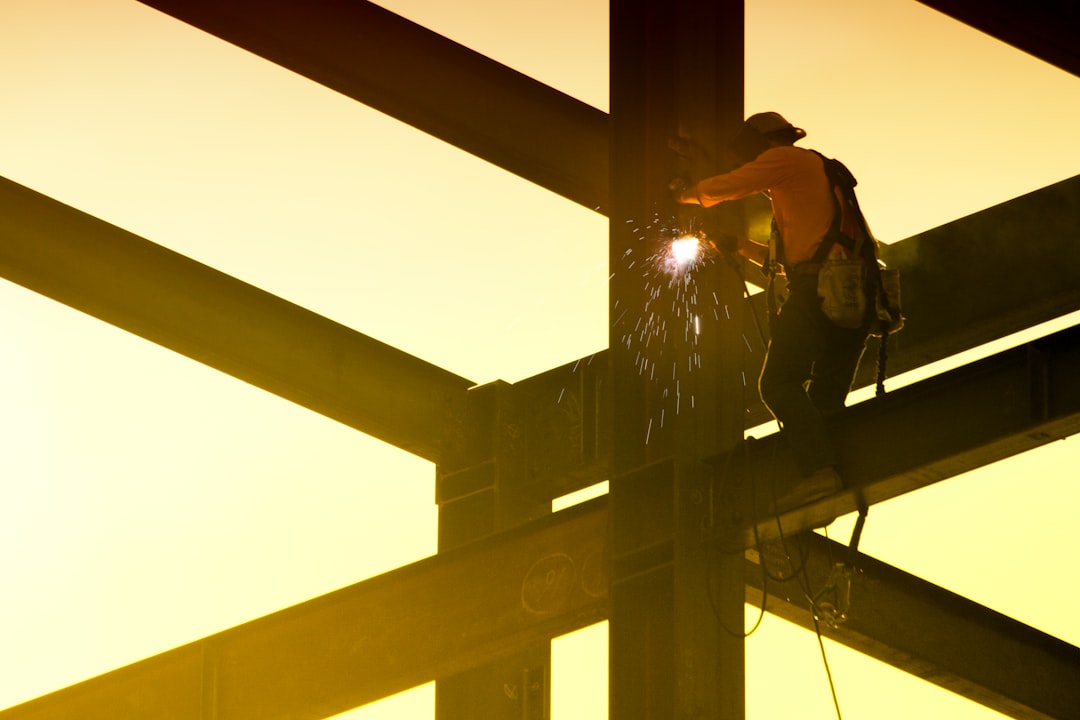gallery-3 man-in-black-jacket-and-black-helmet-standing-on-top-of-building-during-daytime-hlhc8gquw6i