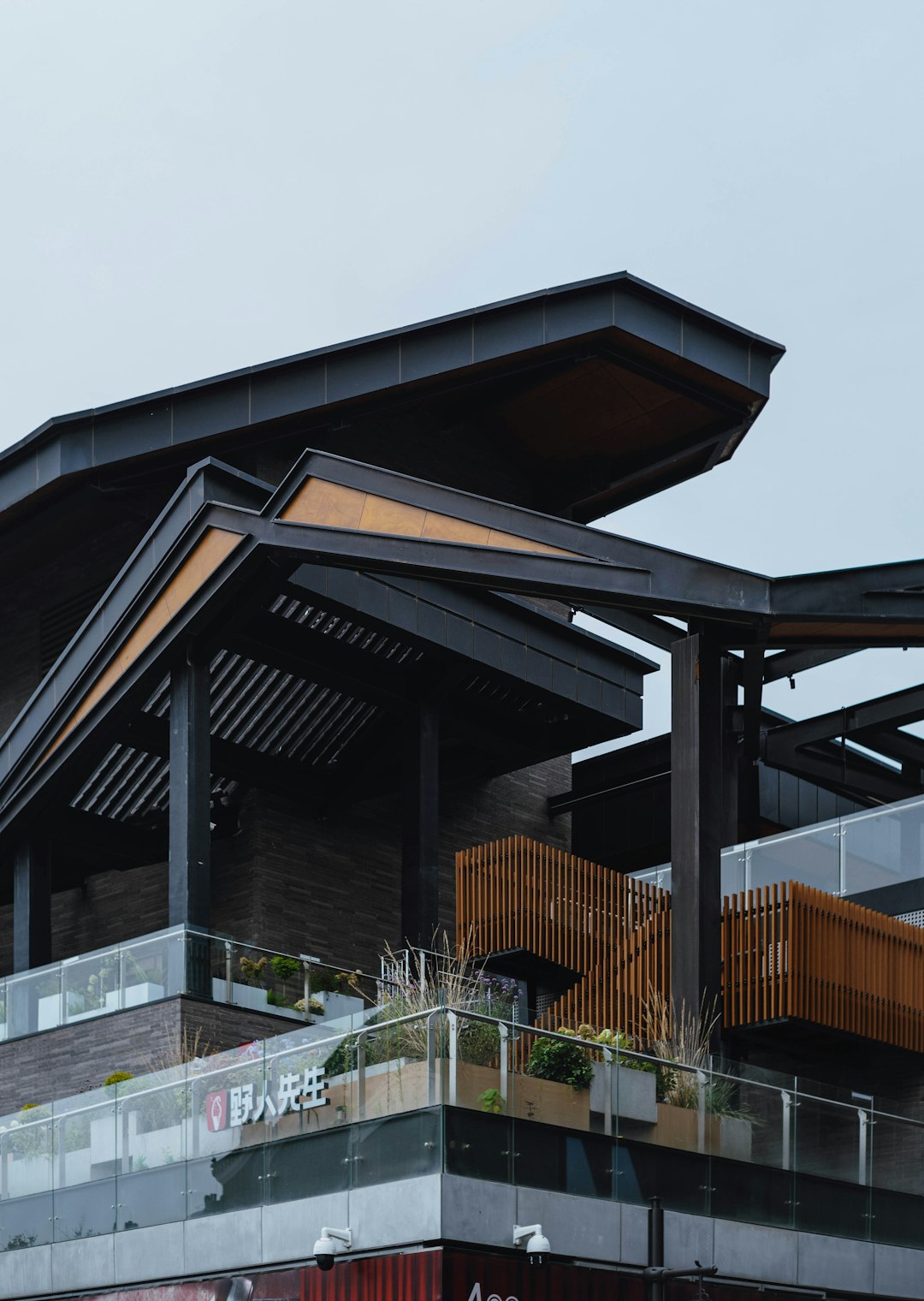 our-experience modern-building-with-geometric-architectural-details-and-greenery-7vj0mt2wuce